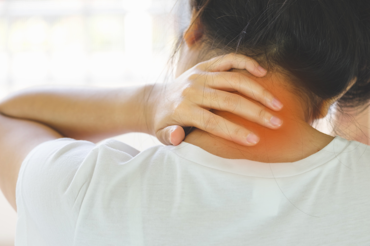 Person experiencing neck discomfort